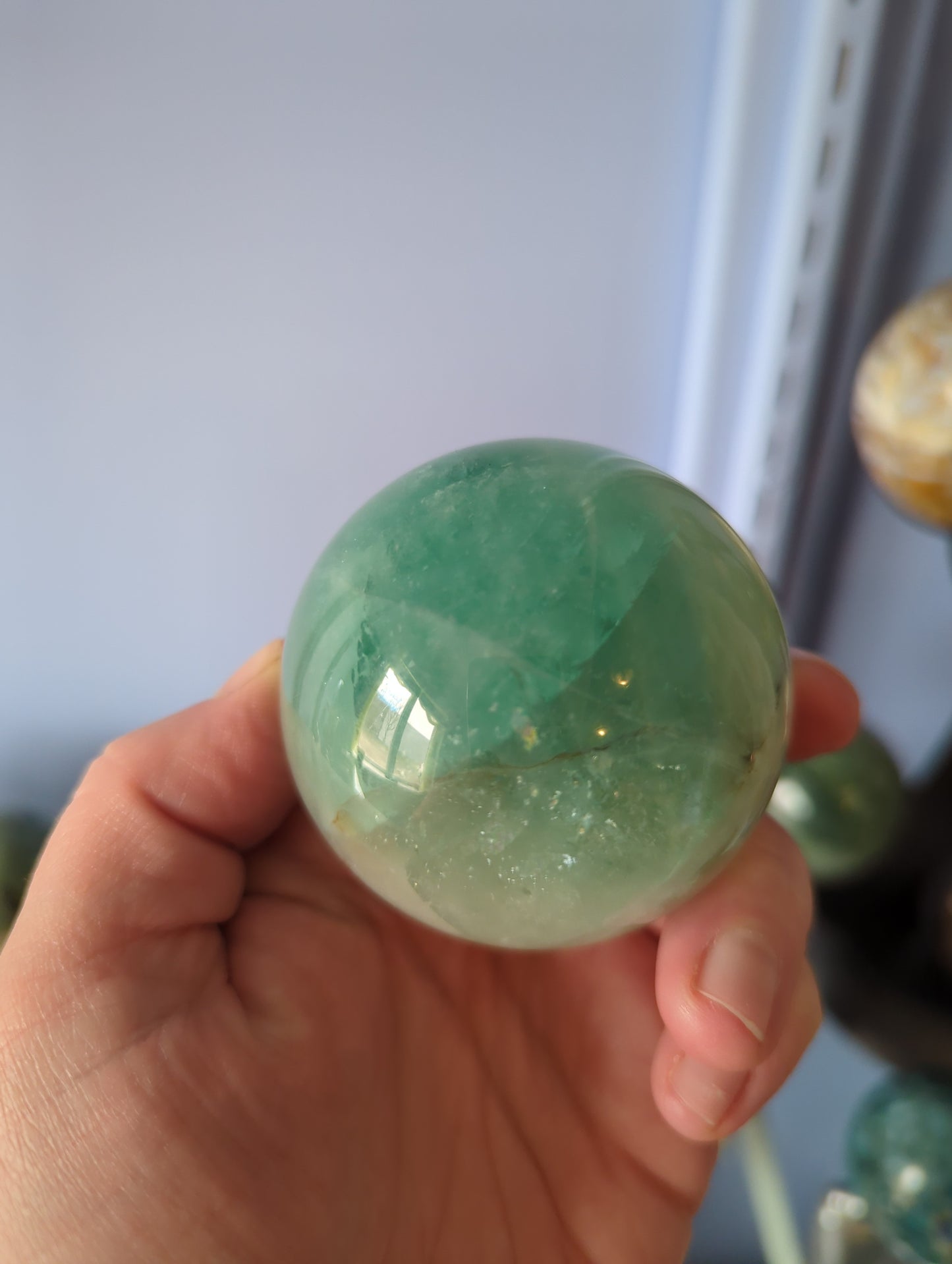 Baja Blue Fluorite Crystal Sphere - Stunning Ocean Blue Fluorite Orb - Translucent Teal Gemstone Centerpiece for Home Altar or Office Decor - Unique Gift